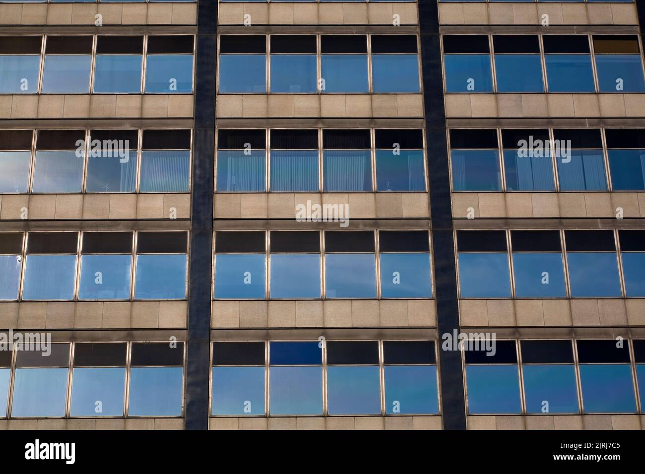 Windows On An Old Glass And Steel Architectural Style Office Tower   Windows On An Old Glass And Steel Architectural Style Office Tower Building Montreal Quebec Canada 2JRJ7C5 