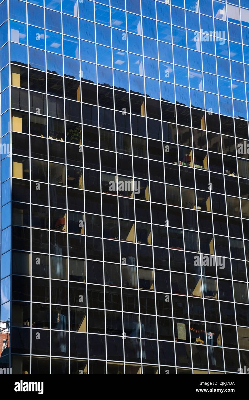 Windows looking into the offices on a modern architectural style office building, Montreal, Quebec, Canada. Stock Photo