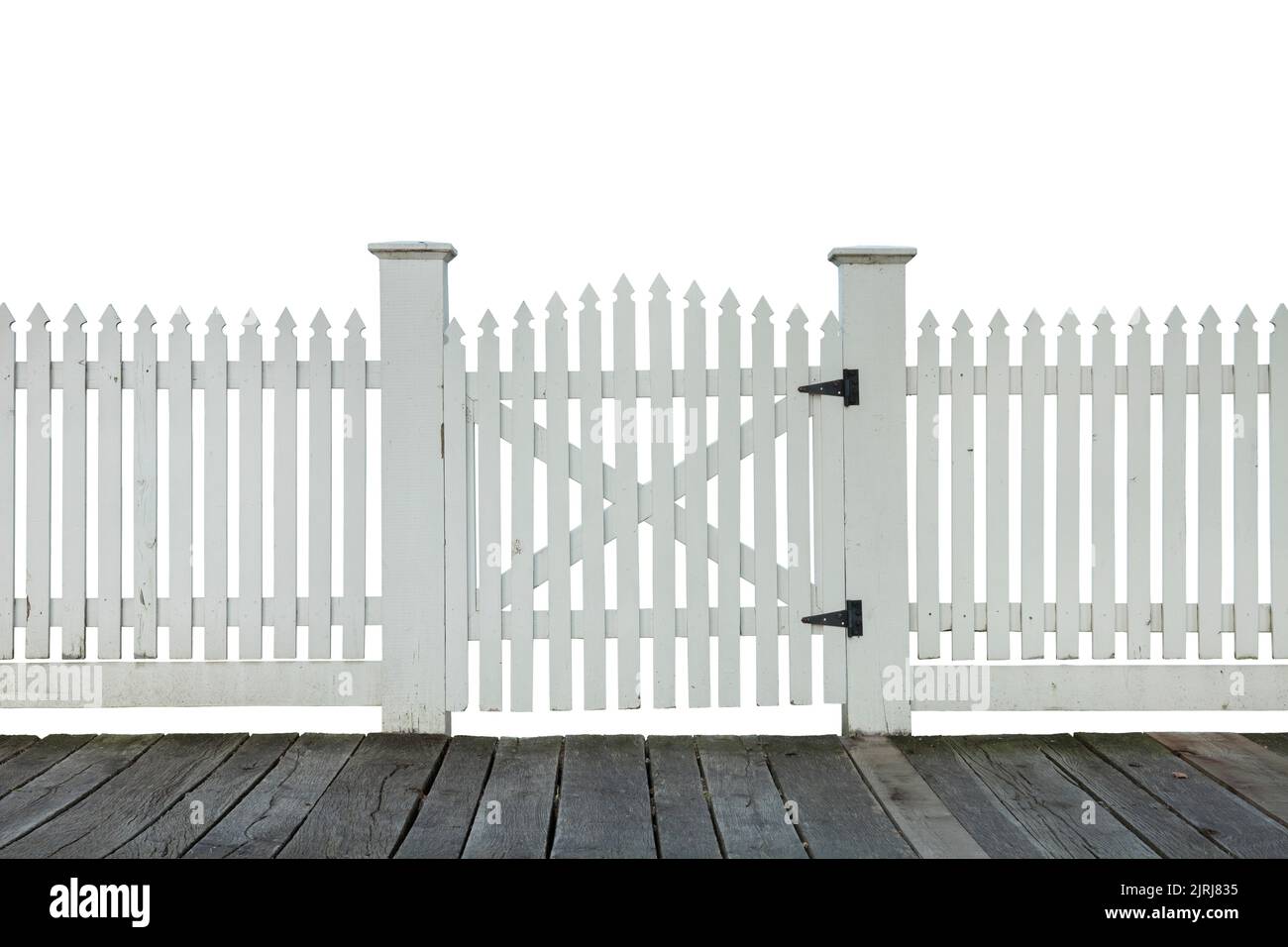 Old white picket fence with gate and wood sidewalk isolated on white background Stock Photo