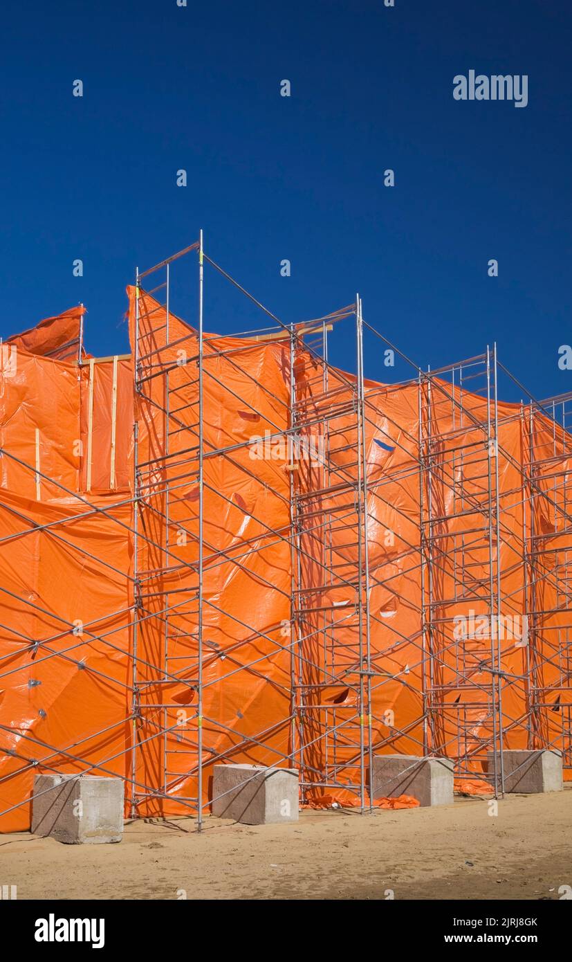 Construction scaffolding plastic sheeting protective hires stock