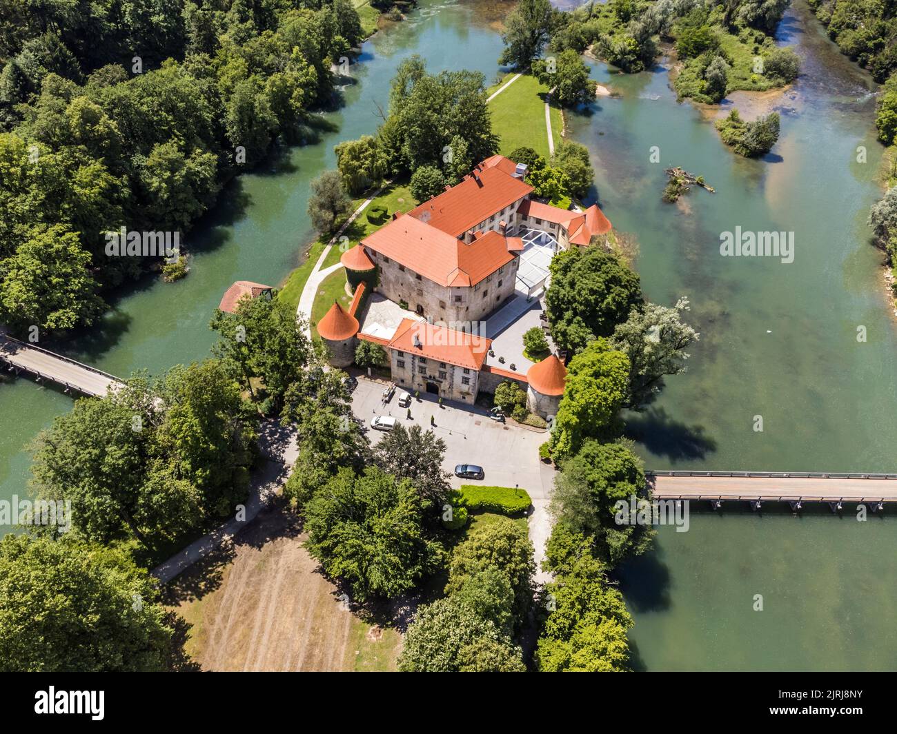 Romantic Otocec Castle on Krka River in Slovenia. Drone View. Stock Photo