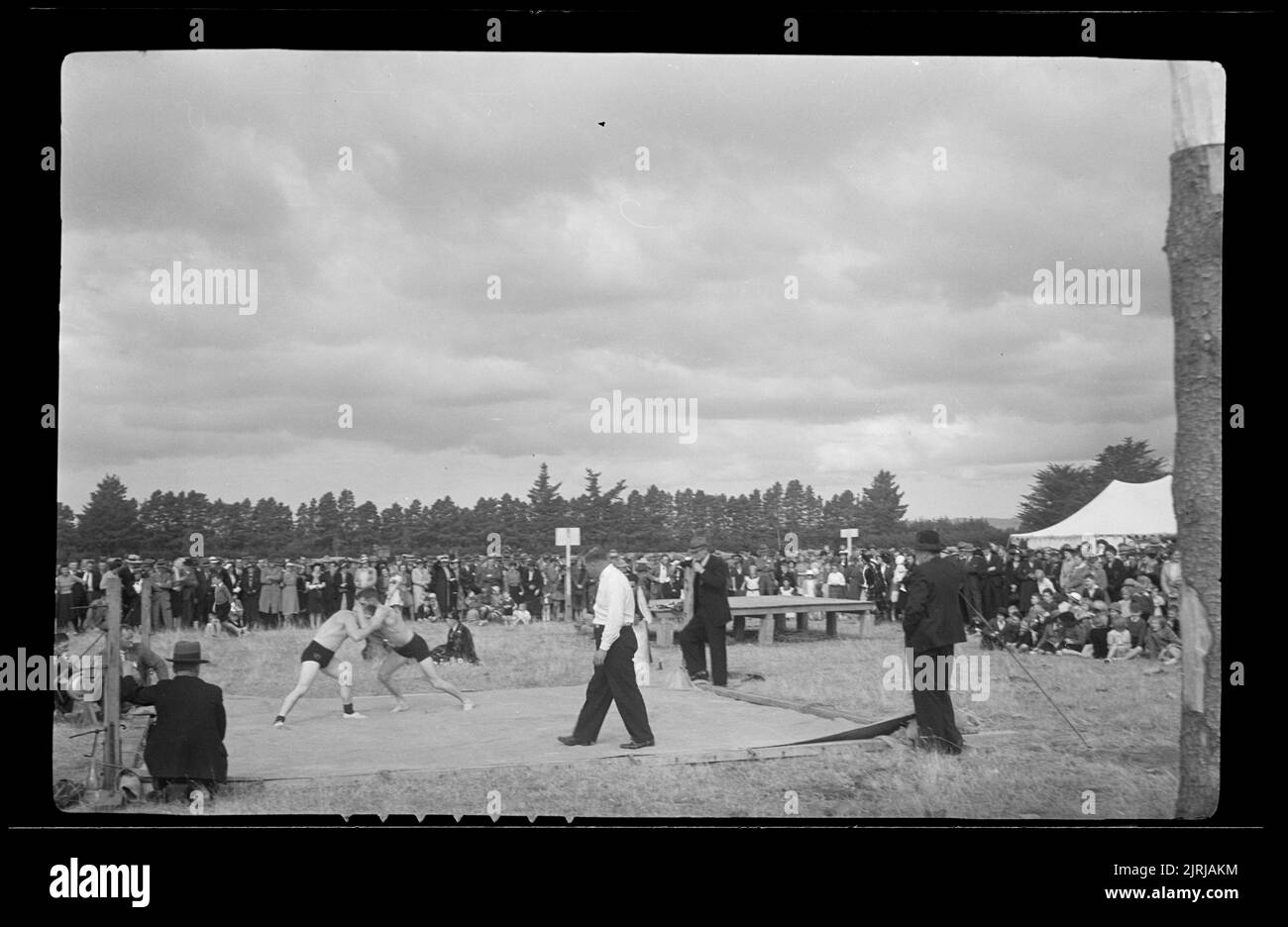 Wrestling contest, Taupo, 1938, Bay of Plenty, by J.W. Chapman-Taylor. Stock Photo