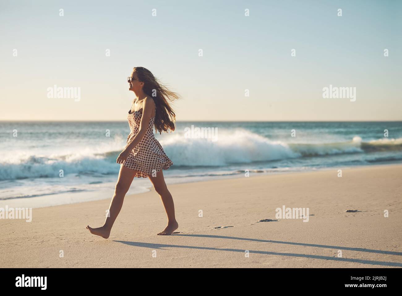 Walk where your heart leads you. a young woman taking a stroll on the