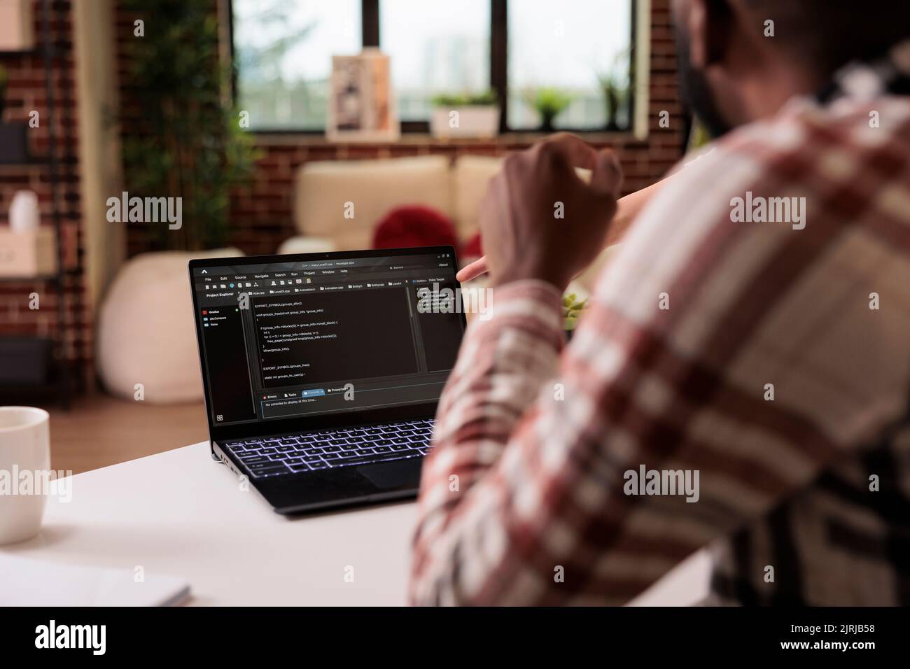 Diverse freelance coders programming html script at home, using