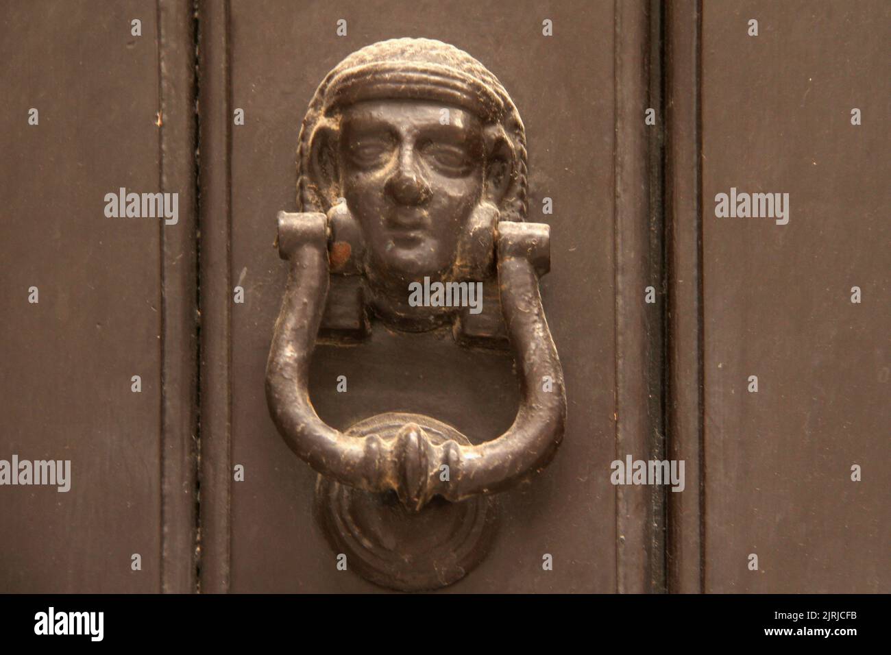 Beautiful door knocker in Italy Stock Photo