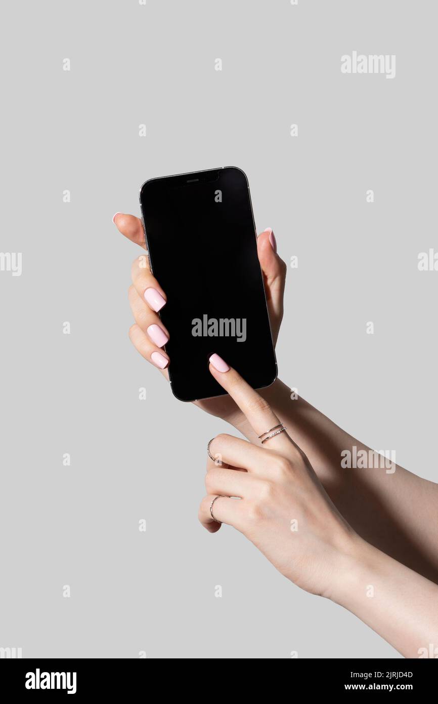 Pretty Android Hand beauty hands motion series holding smartphone Stock Photo - Alamy
