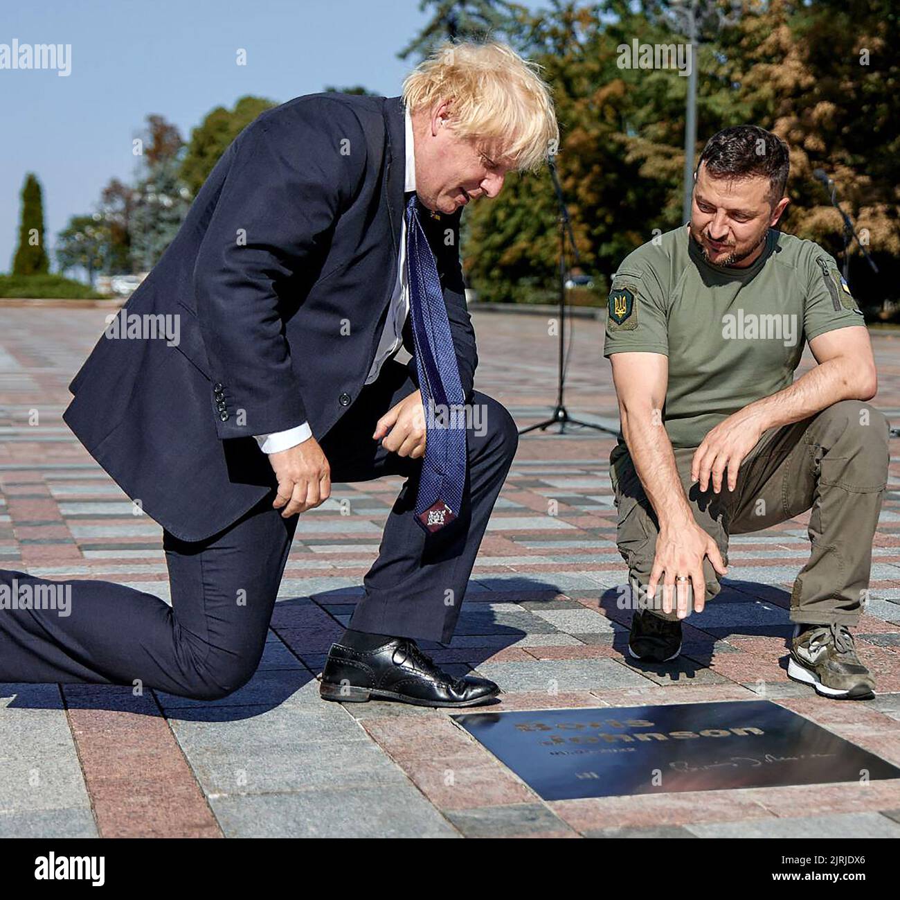 Kyiv, Ukraine. 24th Aug, 2022. Ukrainian President Volodymyr Zelensky (R) shows British Prime Minister Boris Johnson (L) his name engraved on a plaque inaugurated at the Ally of Bravery on Ukraine's Independence Day Wednesday on August 24, 2022, amid Russia's invasion of Ukraine. Photo by Ukrainian President Press Office/UPI Credit: UPI/Alamy Live News Stock Photo