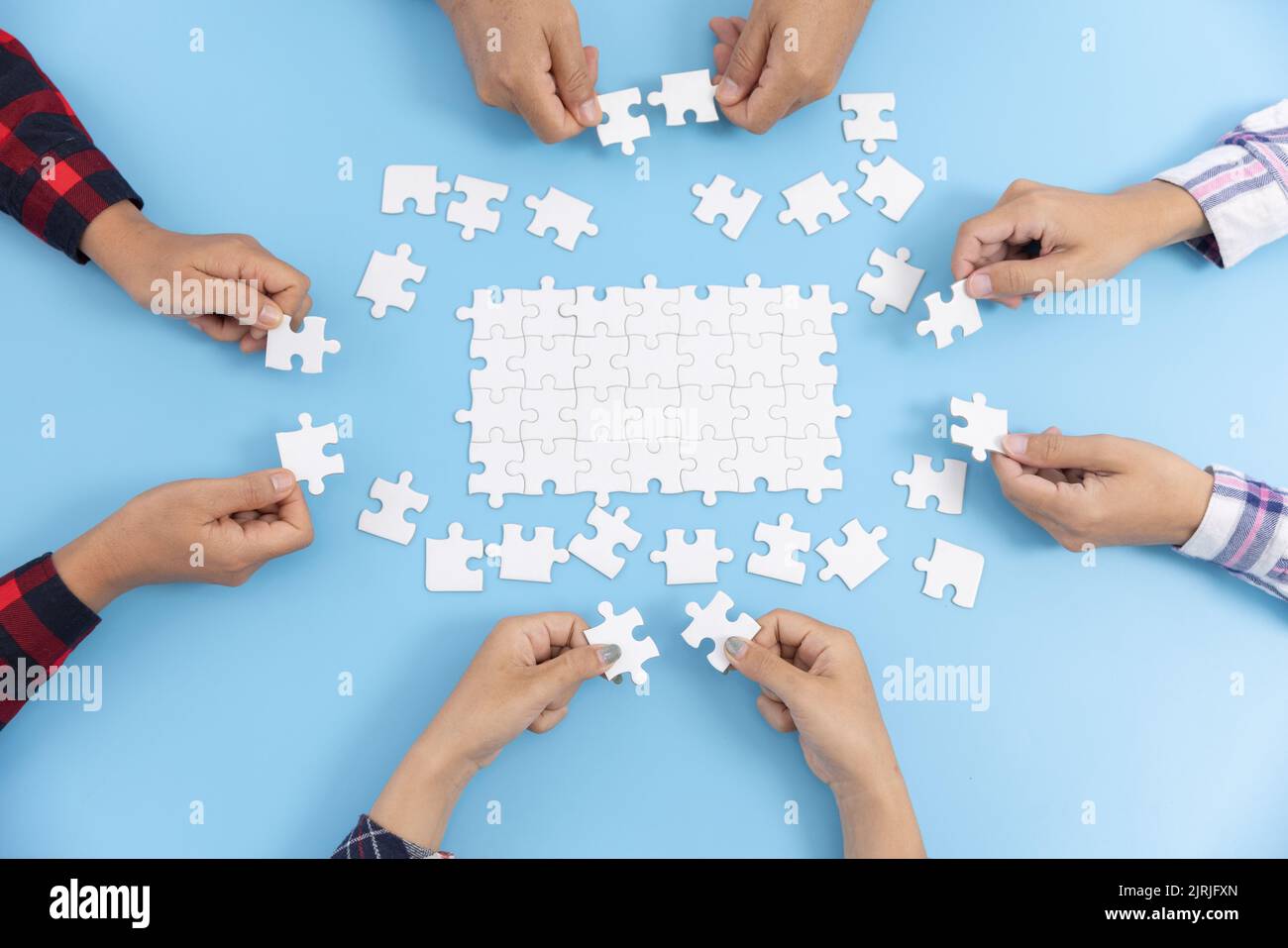 Man holding in hand puzzle element and looks for a solution to assemble  last jigsaw piece. Concept of project finishing, work solutions, suggestion  of creative ideas. Flat style vector illustration. 4737057 Vector