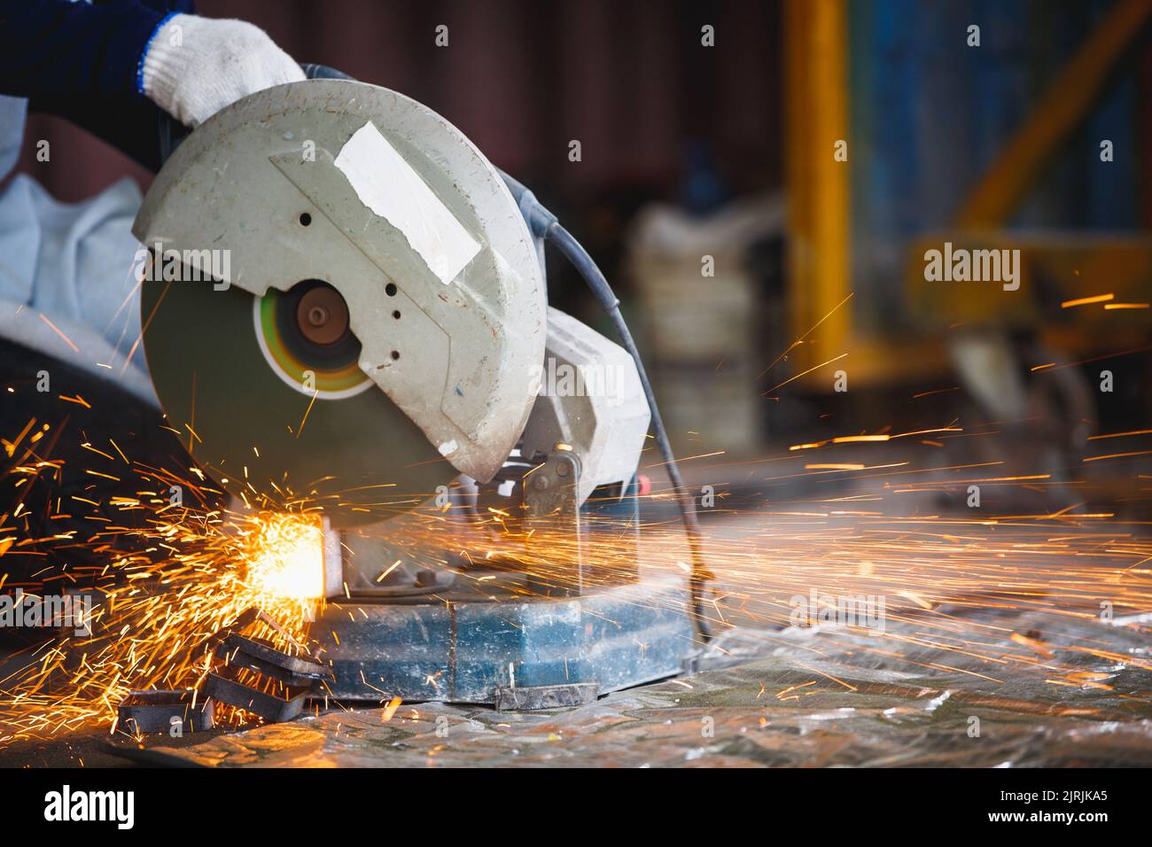 Cutting of a steel with splashes of sparks, Metal processing with angle