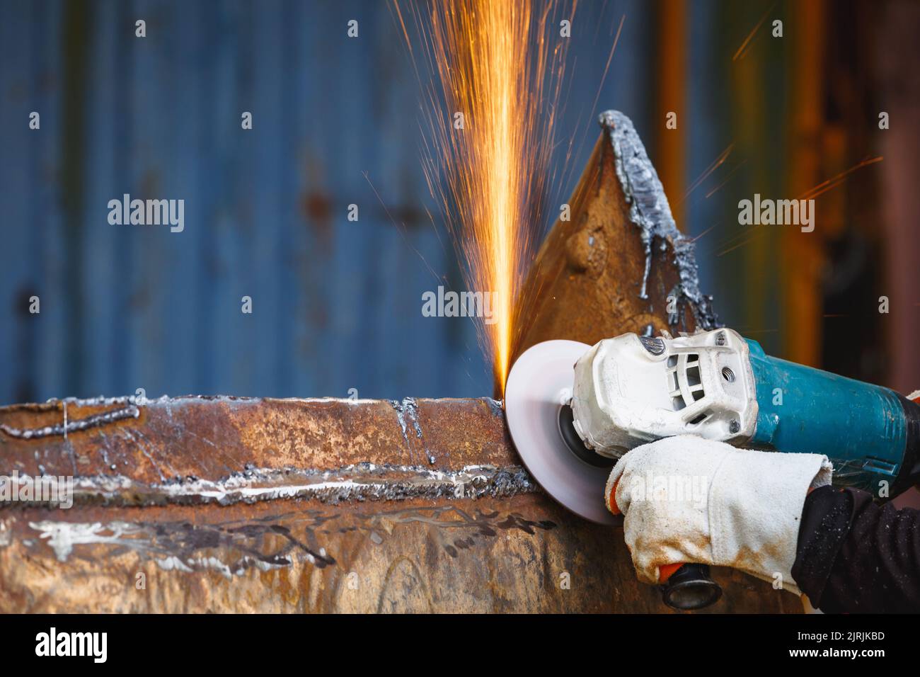 Grinding wheel electric on steel structure in factory sparks from grinding wheel. roughing and polishing metals,   Sparks in metalworking. Stock Photo