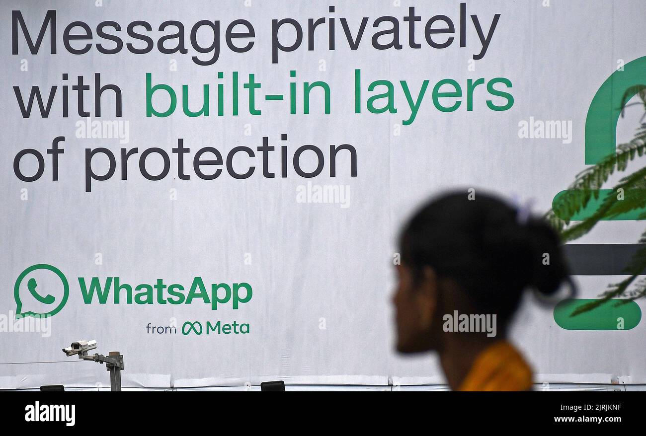 Mumbai, India. 24th Aug, 2022. A woman looks at WhatsApp logo displayed on a hoarding in Mumbai. WhatsApp is an instant messenger and voice over internet protocol owned by American company Meta that lets people connect with each other for casual or business related networking across the world. Credit: SOPA Images Limited/Alamy Live News Stock Photo