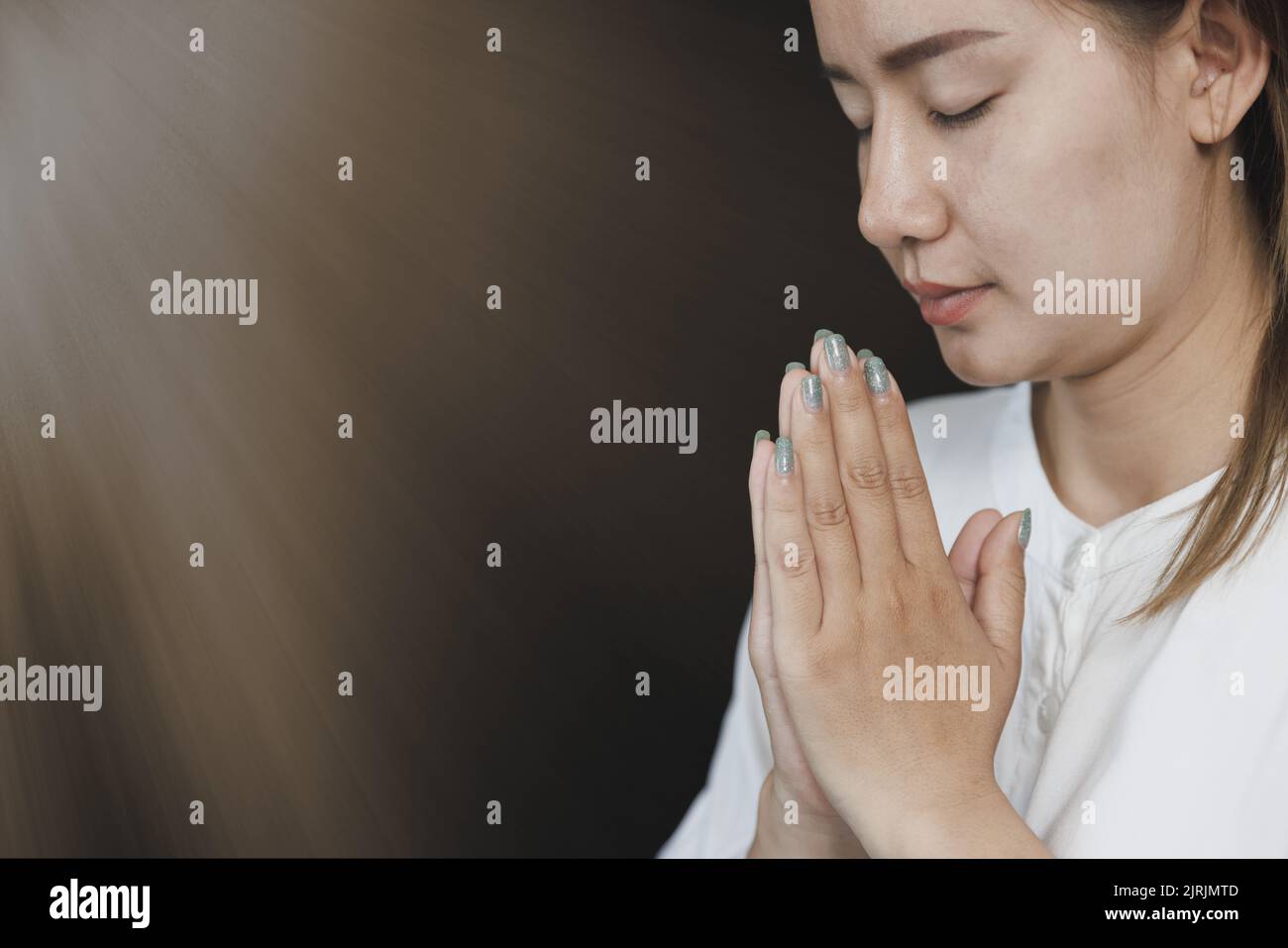 Pay respect, woman Praying hands with faith in religion. Namaste or Namaskar hands gesture,  Prayer position. Stock Photo