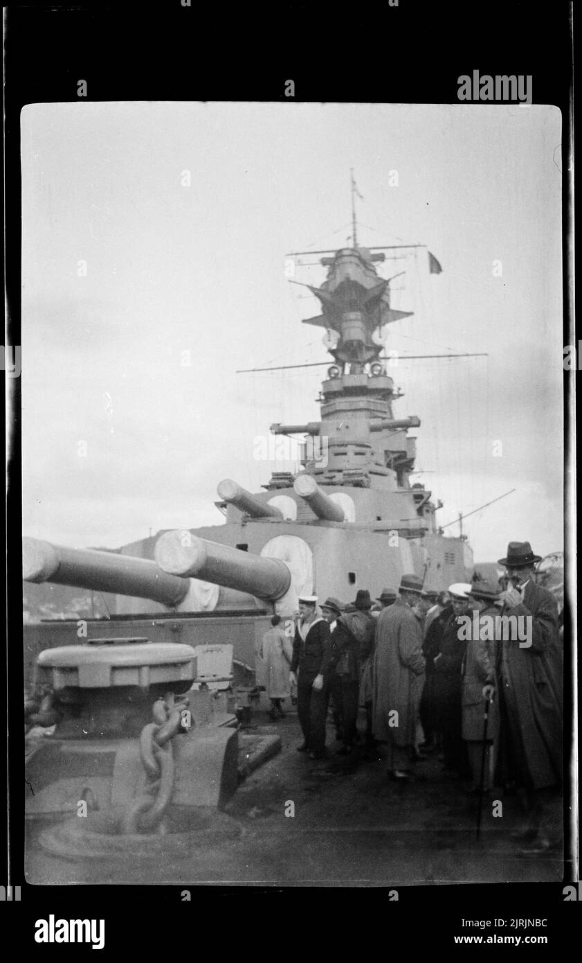 [Crowds on deck of a battleship in Wellington harbour], 1920s-1930s, Wellington, by Roland Searle. Stock Photo