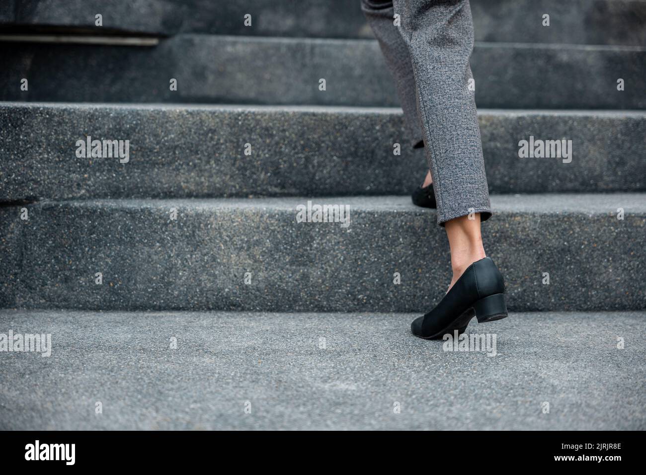 Stepping going up stairs in city, Closeup legs of businesswoman hurry
