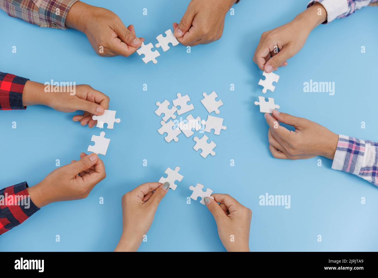 The concept of cooperation. A group of business people assembling