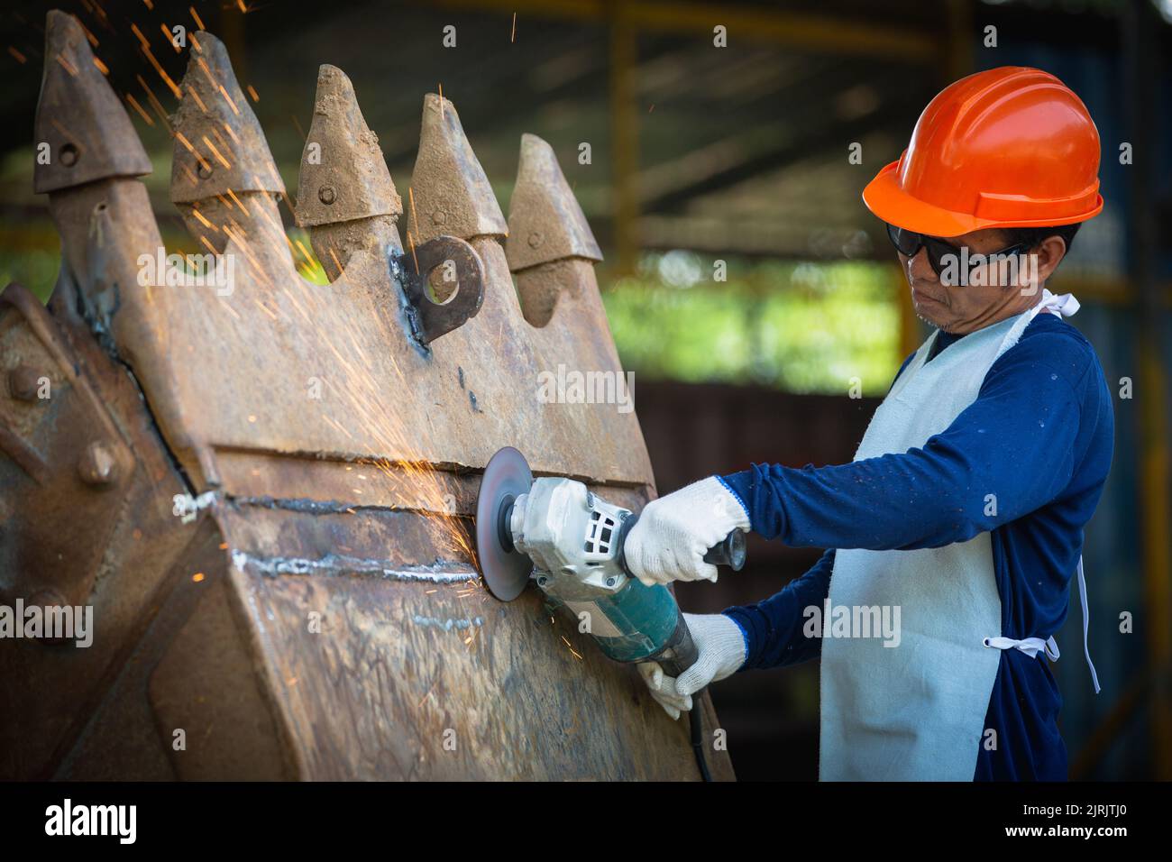 Grinding wheel electric on steel structure in factory sparks from grinding wheel. roughing and polishing metals,   Sparks in metalworking. Stock Photo