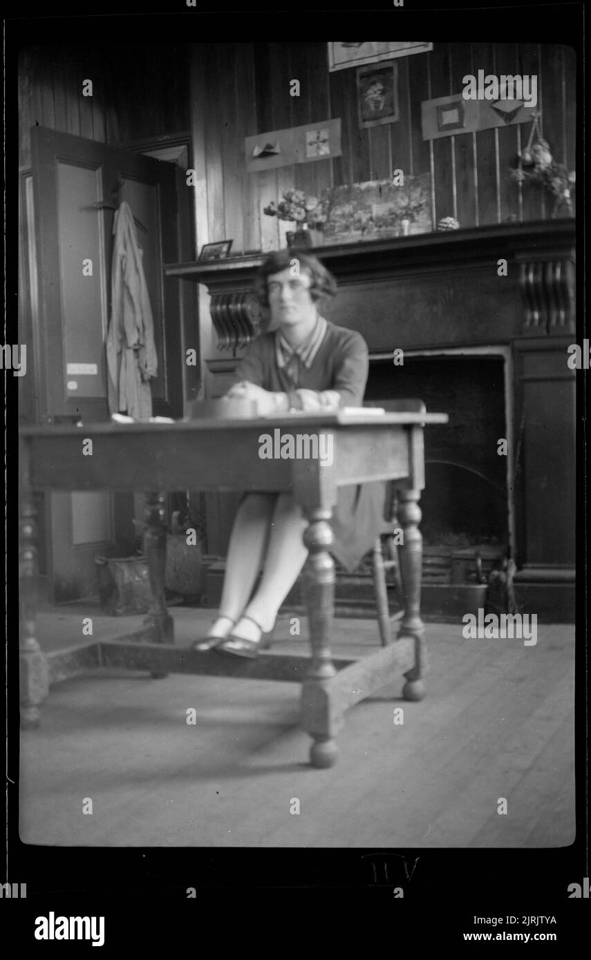 [Woman seated at table], 1920s to 1930s, by Roland Searle Stock Photo ...
