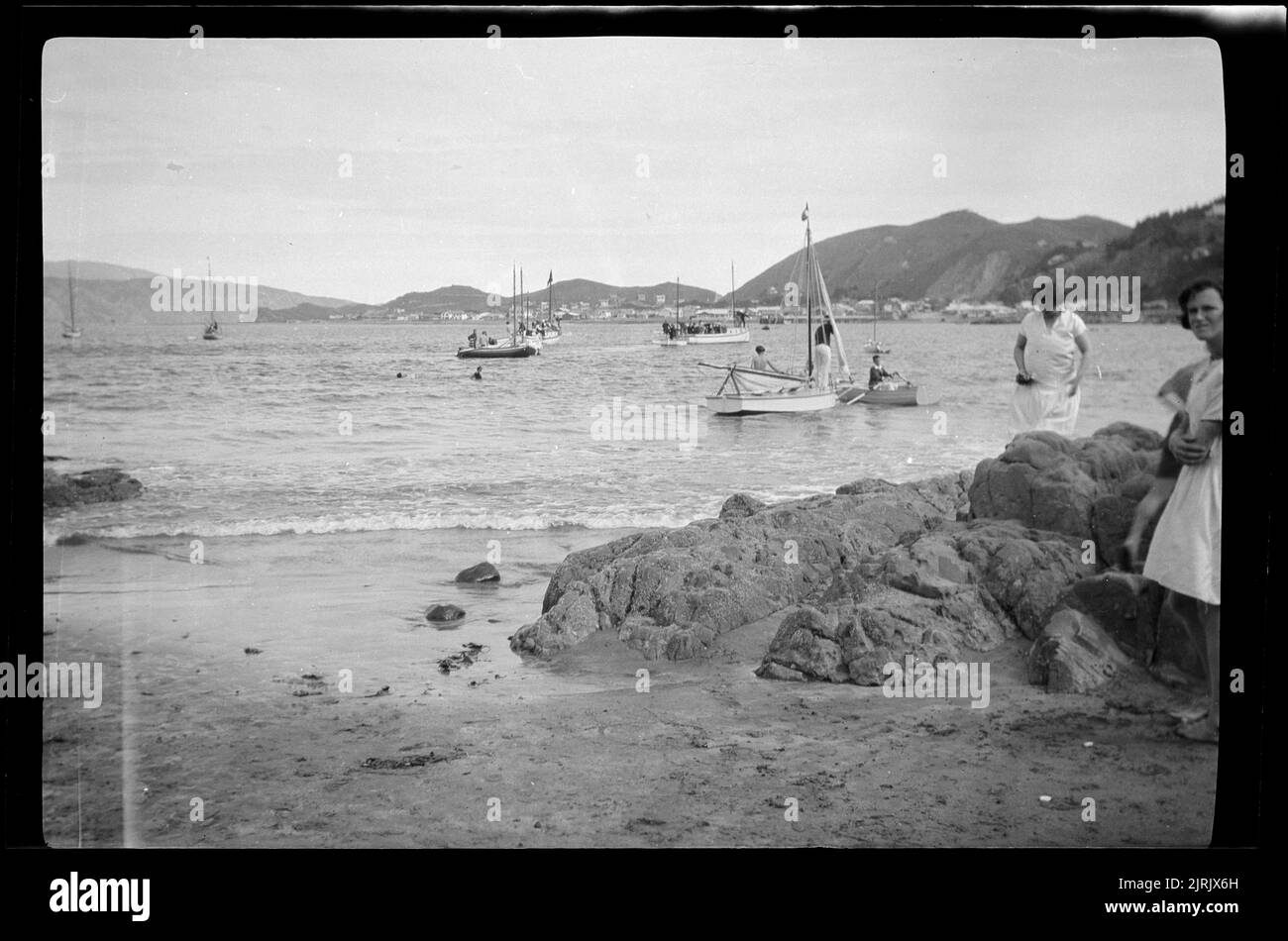 Yachts and women at bay, Wellington harbour, 1920s to 1930s, by Roland Searle. Stock Photo
