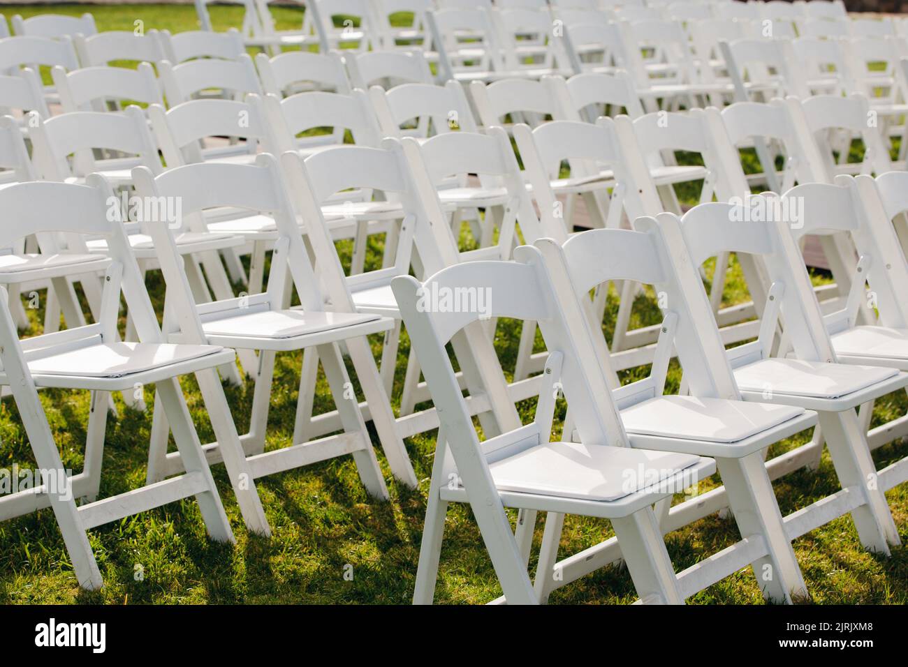 White folding chairs hi-res stock photography and images - Alamy
