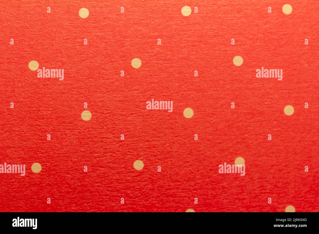 Full frame abstract texture background of solid red and yellow polka dots pattern with selective focus Stock Photo