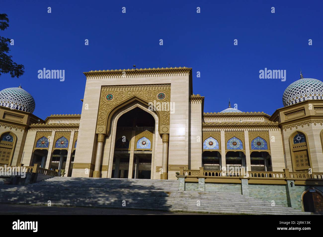 Beautiful Islamic Center Mosque in Lhokseumawe with blue sky.. Stock Photo