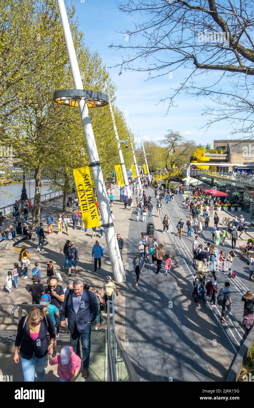 South Bank, London, UK. 15th April   2022. Elevated view of London's South Bank promenade bustling with people enjoying the local atmosphere. Stock Photo