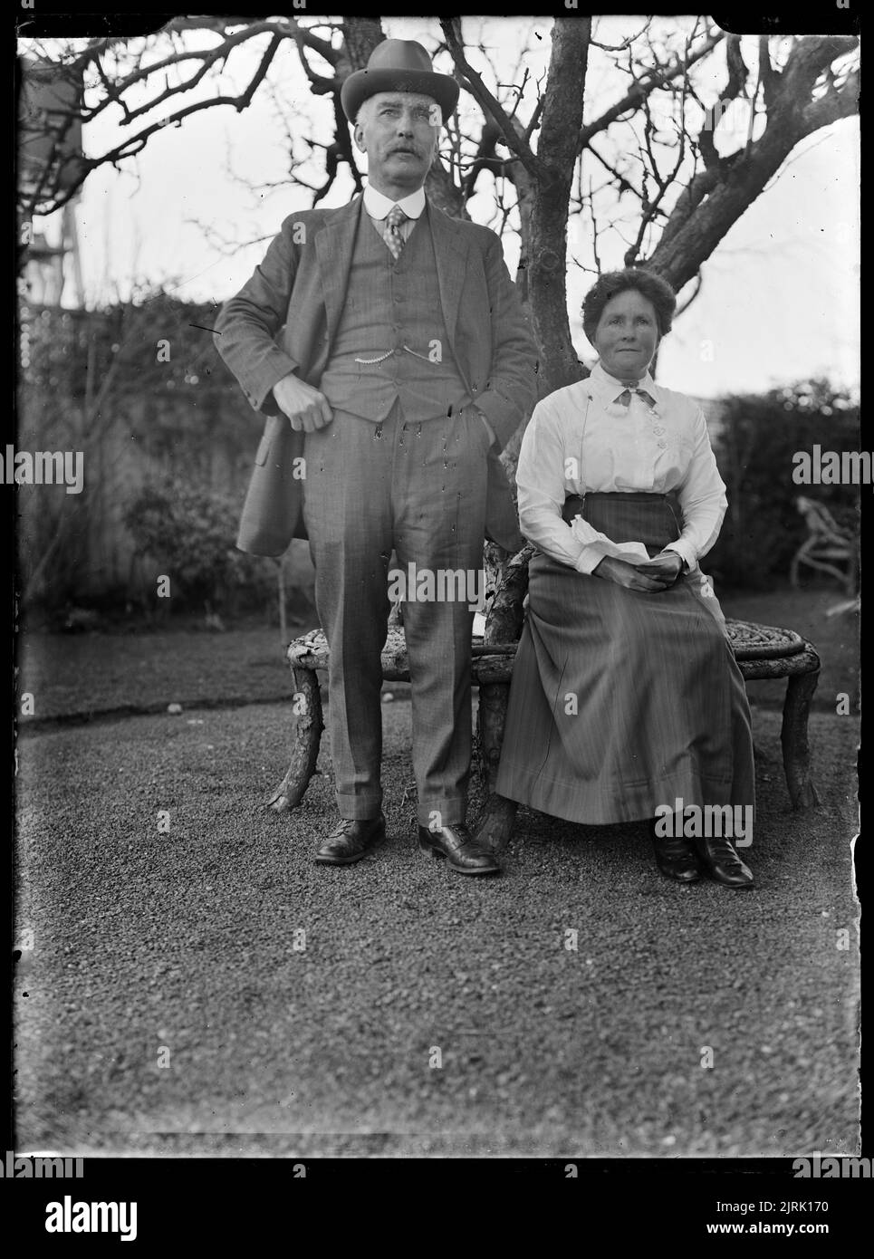 People beneath a tree, 19001917, Dannevirke, by Alfred Henderson Stock