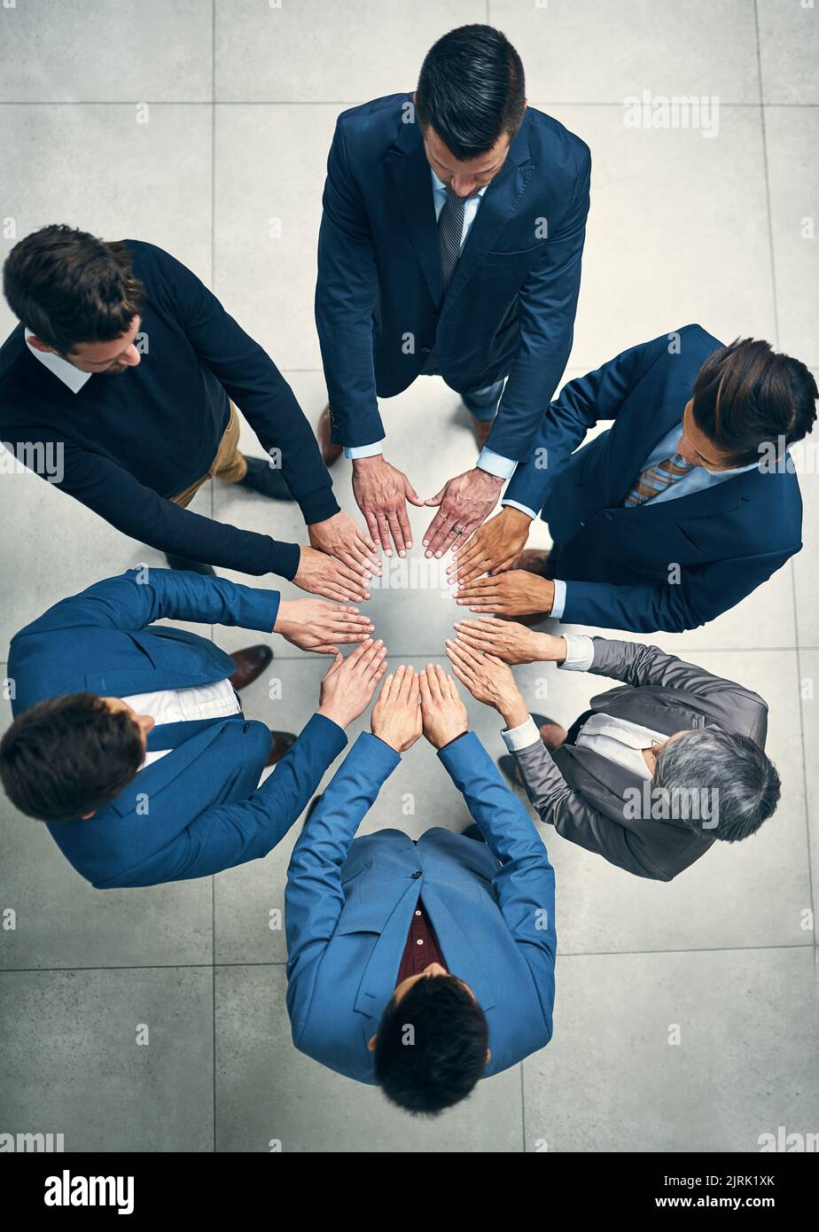 Sticking together to achieve success together. High angle shot of a