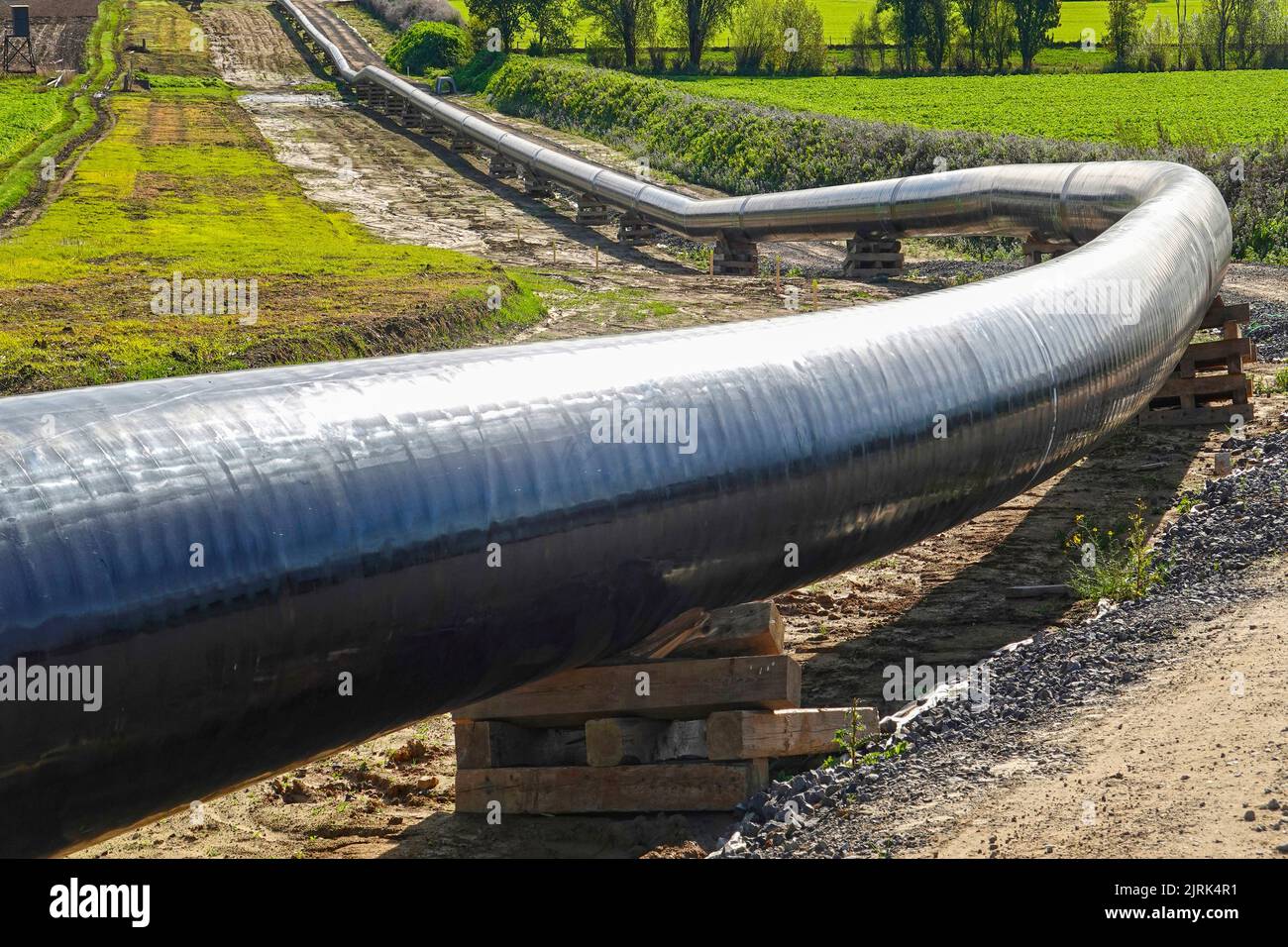 Gas pipeline construction, assembled pipeline, ready for placing in the ground Stock Photo