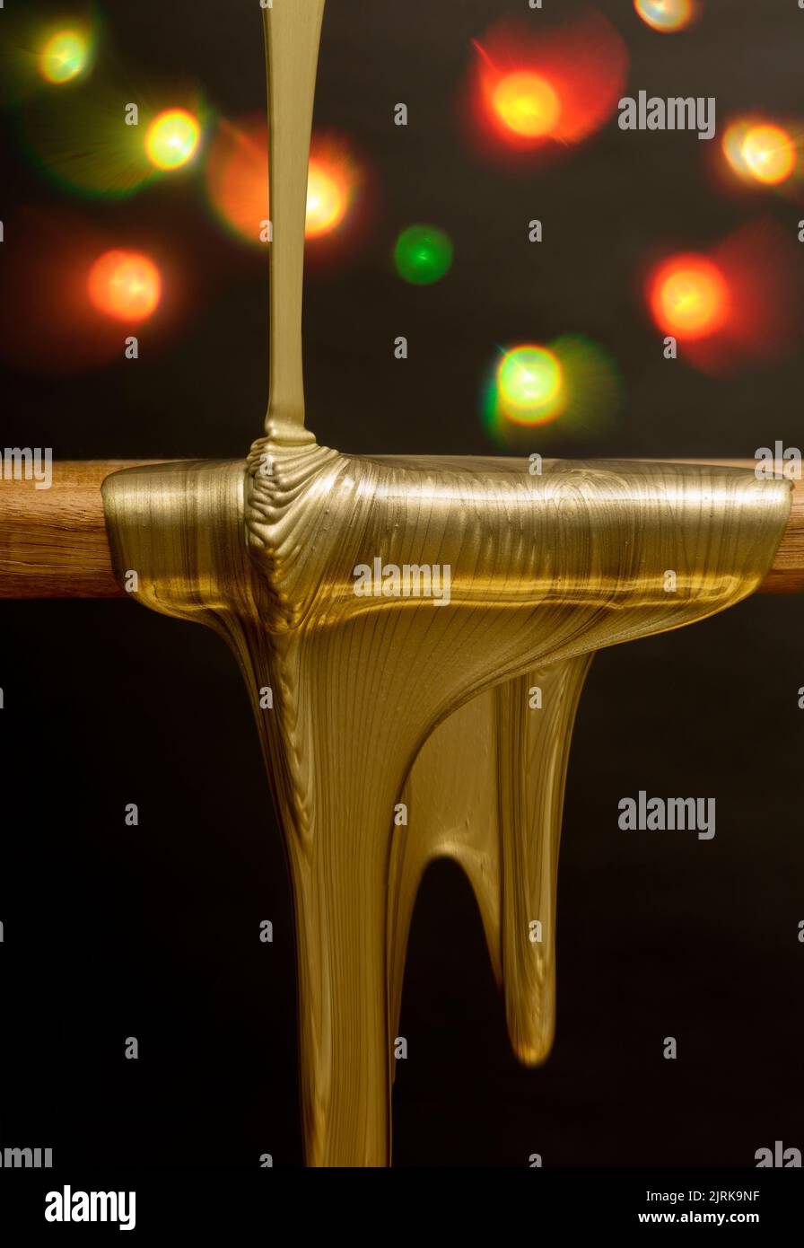 Dripping liquid gold and lights Stock Photo