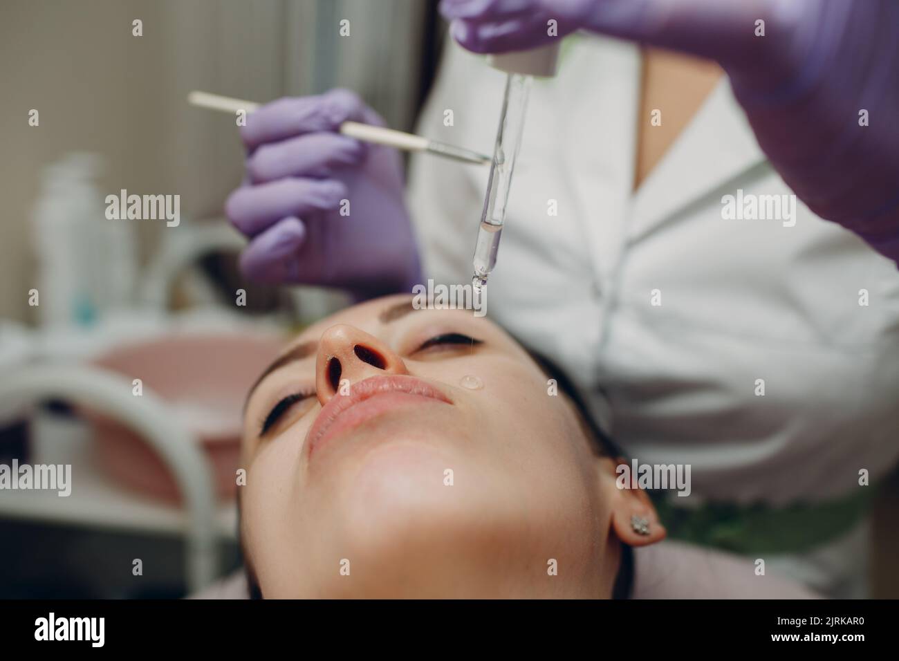 Facial acid peeling mask with retinol and fruit acids in beauty spa