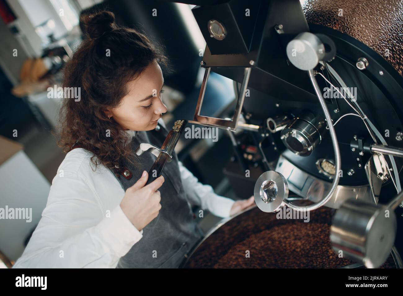 Tryer Sample Coffee roaster machine and barista with tryer at coffee roasting ...