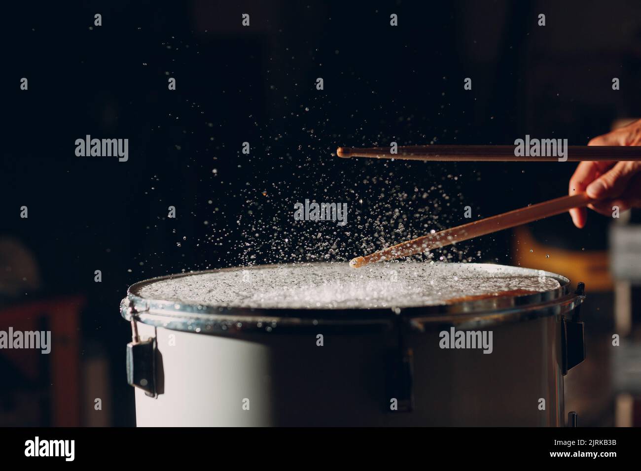 Close up drum sticks drumming hit beat rhythm on drum surface with