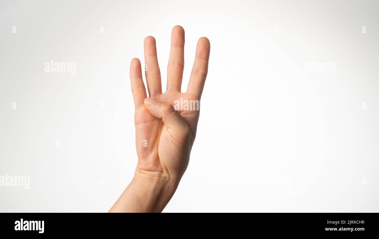 Women's hands gesture counting on fingers 4 palm side. High quality