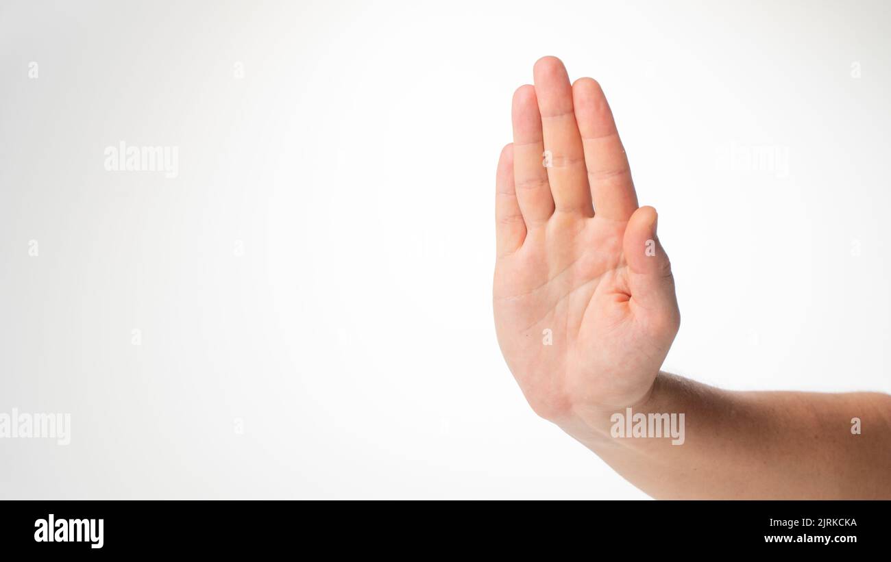 Men's hand gesture stop on a white background. High quality photo Stock Photo