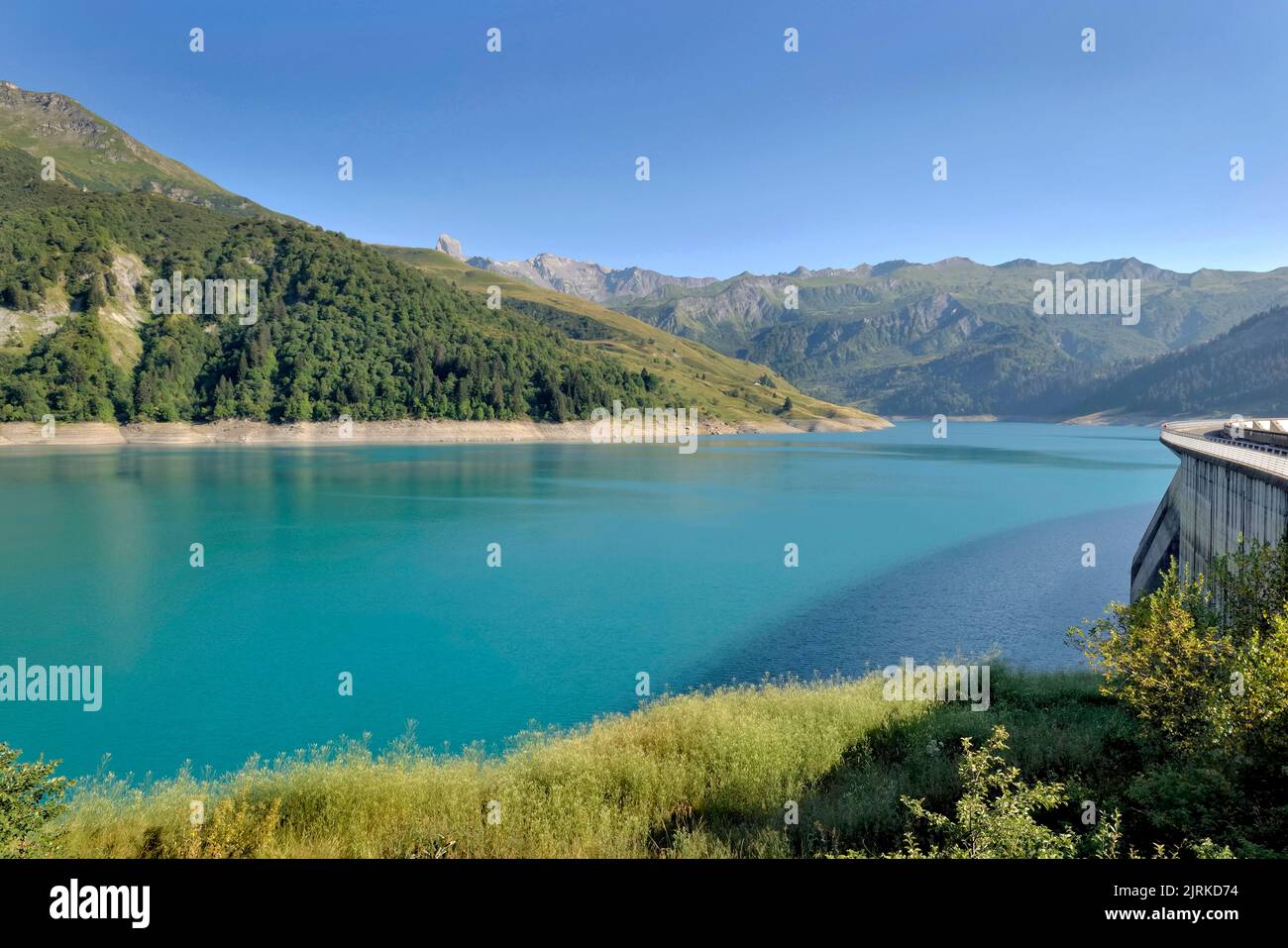 the roselend dam with turquoise water in a mountainous landscape in France Stock Photo