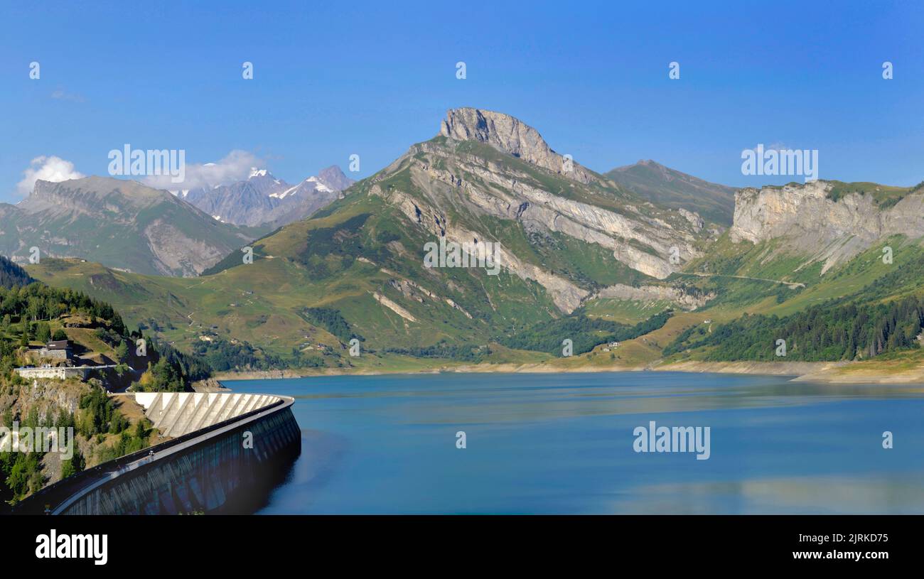 the roselend dam with turquoise water in a mountainous landscape in France Stock Photo