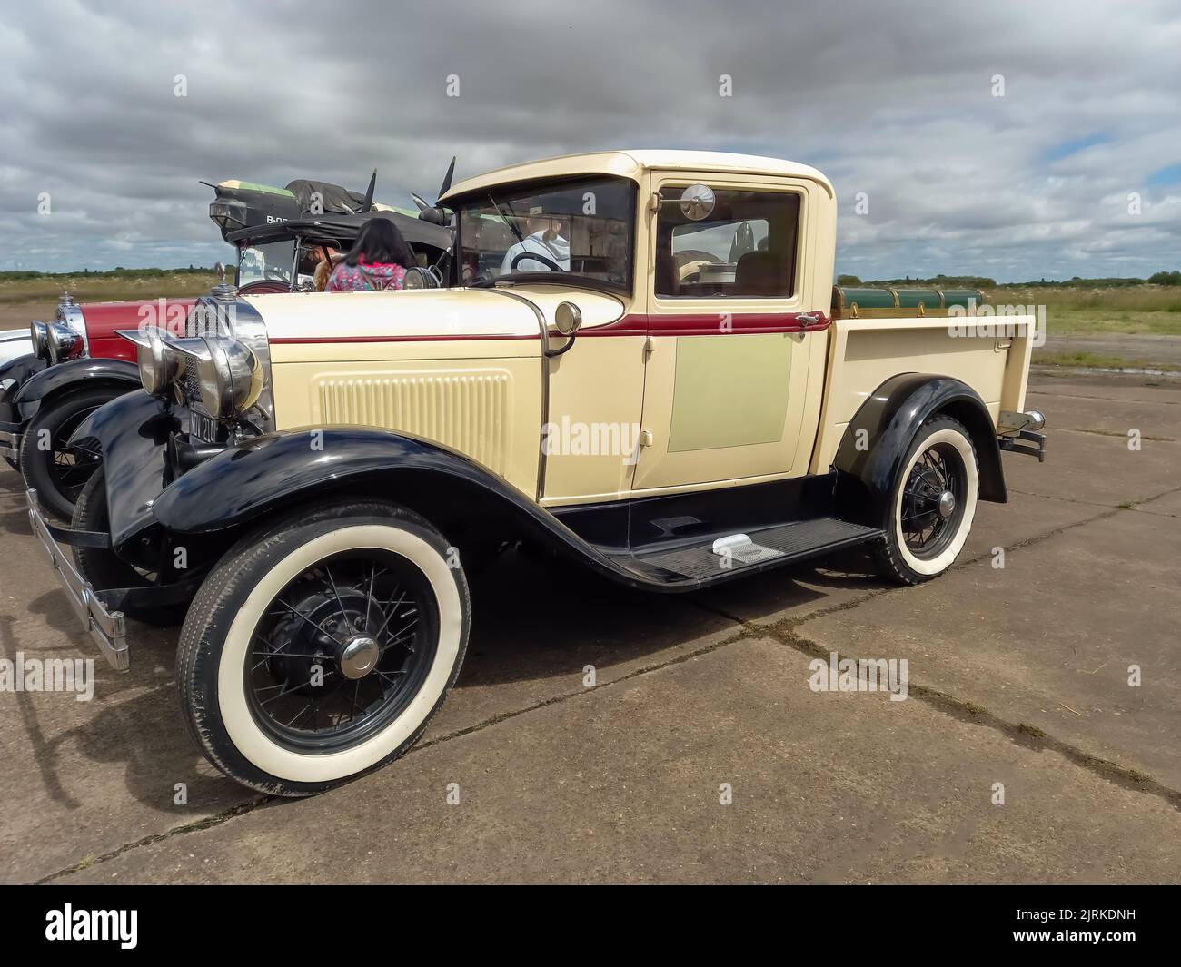 Moron, Argentina - Mar 26, 2022 - Old cream Ford Model A pickup truck cargo utility circa 1930. Side view. CADEAA 2022 classic car show. Stock Photo