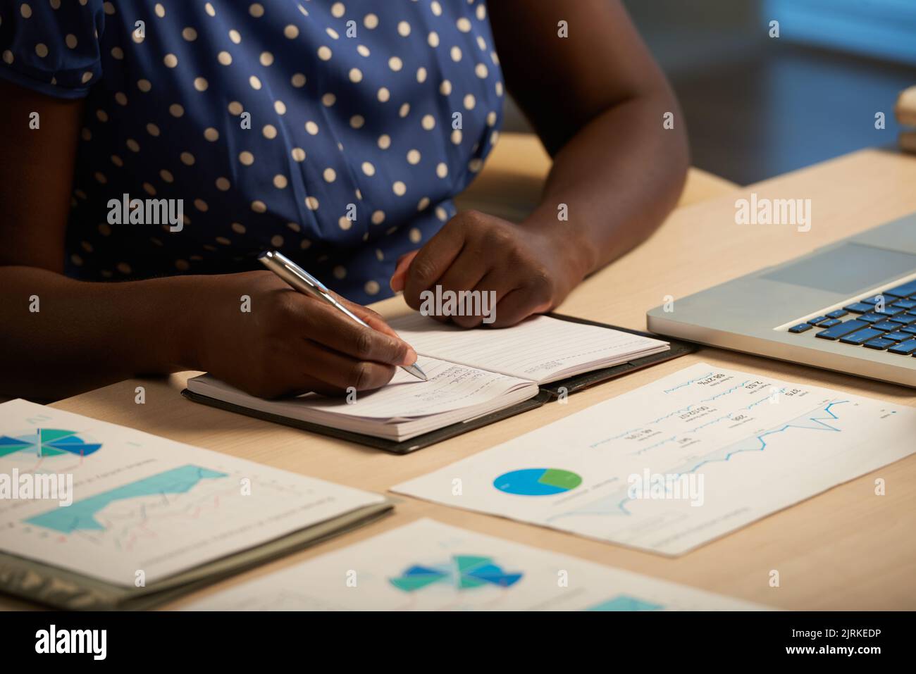 Cropped image of business lady taking notes in her planner Stock Photo