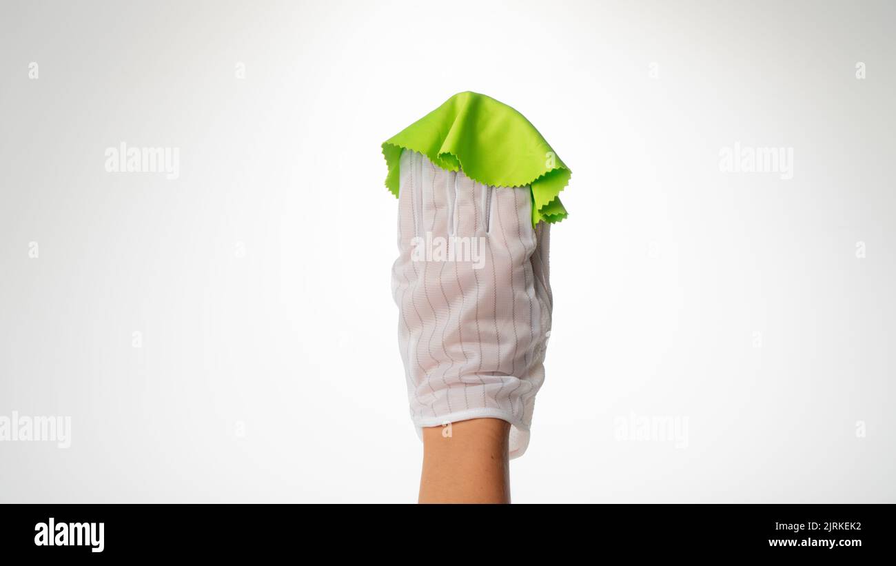 Hand in a rag glove to wipe the dust off the screen Stock Photo - Alamy