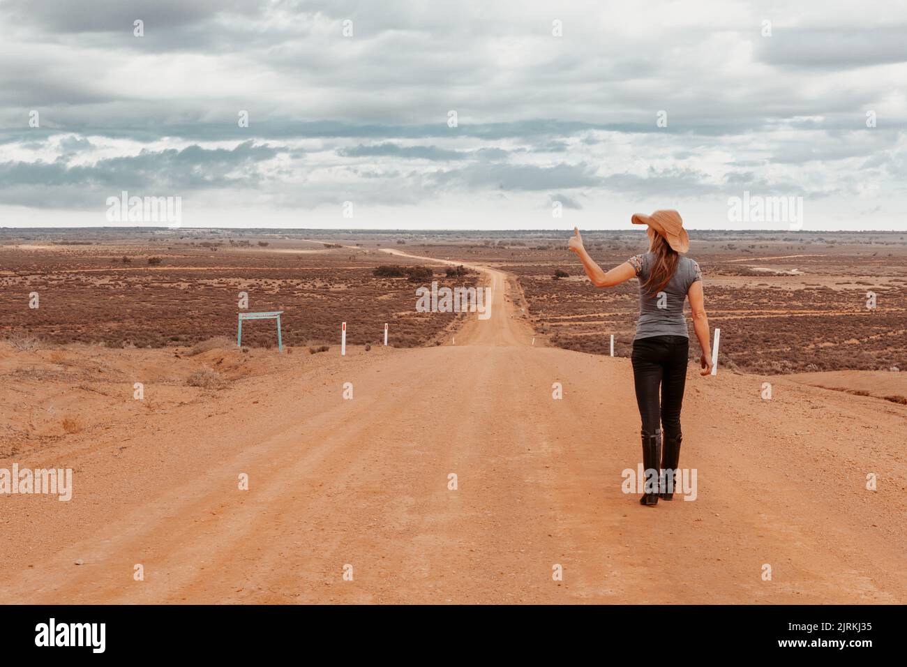 The Australian outback is harsh environment with long roads to nowhere with dried up lakes Stock Photo