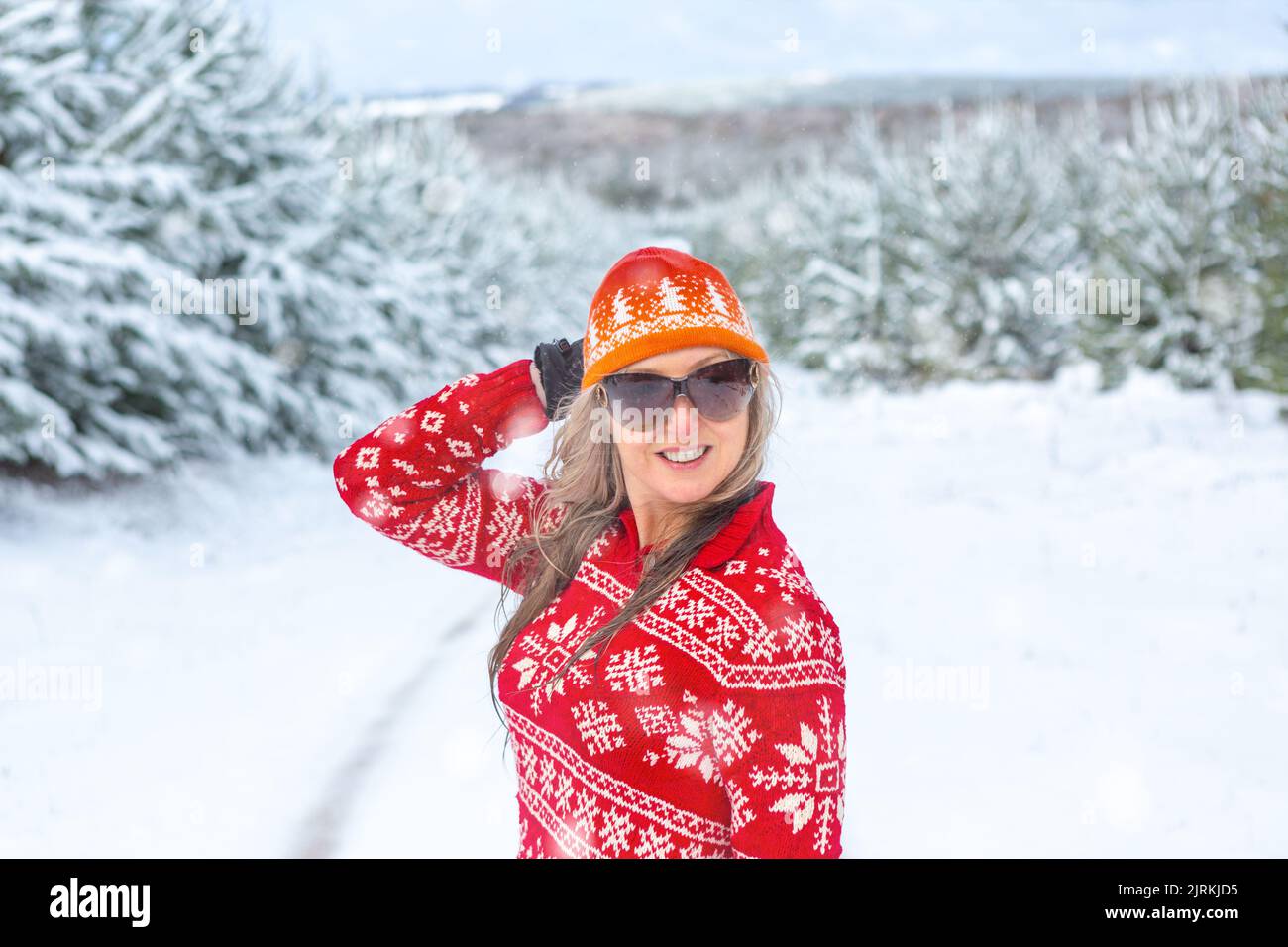 Happy woman enjoying the snow covered landscape in Australia during winter Stock Photo