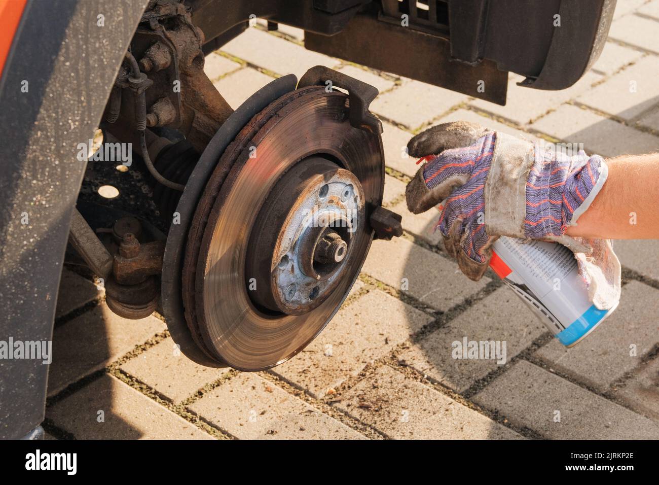 Car repair concept. Repair of a wheel on a passenger car. Wheel balancing or repair. Stock Photo