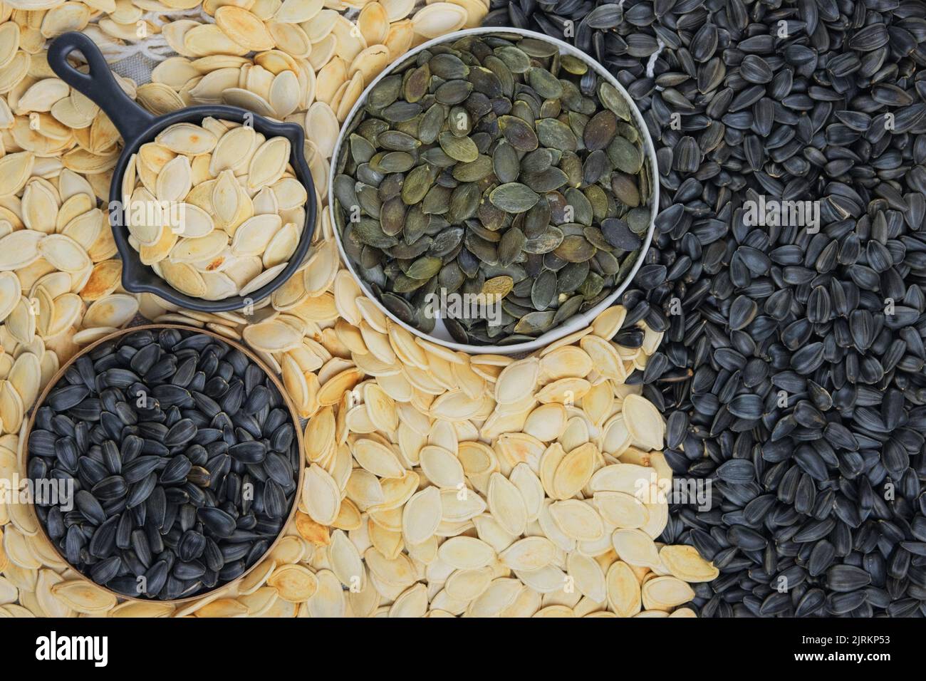 Pumpkin and sunflower seeds in bowl. Dried cereal seeds and fruits
