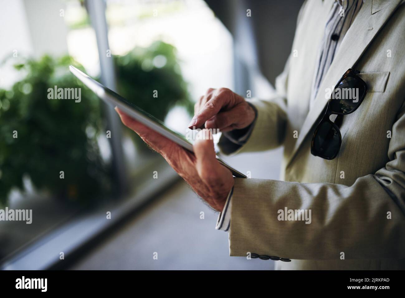 Close-up image of businessman using application on digital tablet Stock Photo