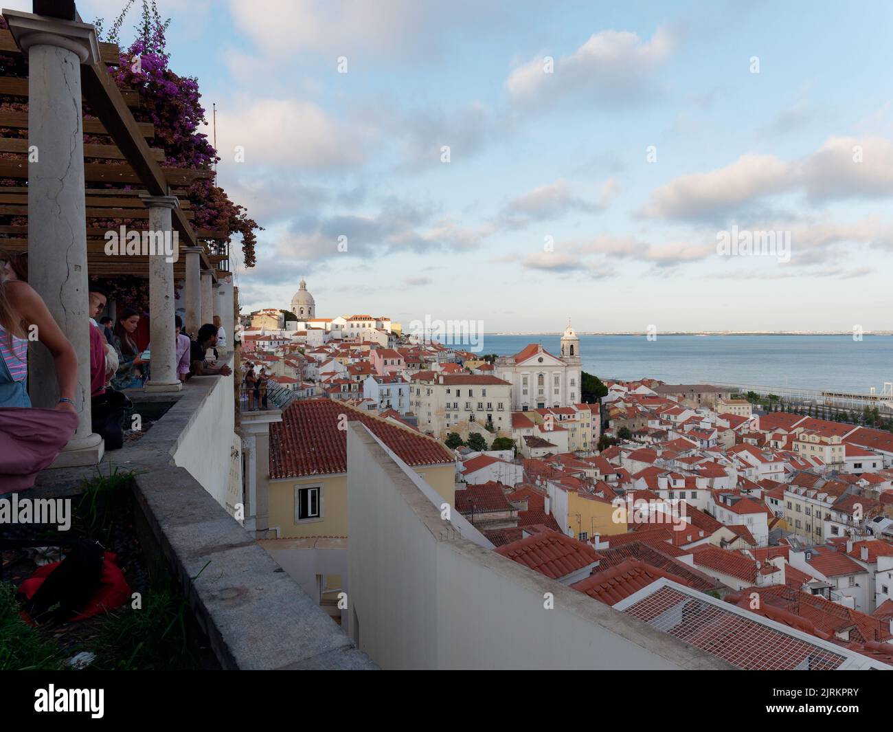 View from Viewpoint Miradouro de Santa Luzia in Lisbon Portugal on a summers evening. River Tagus right. Stock Photo