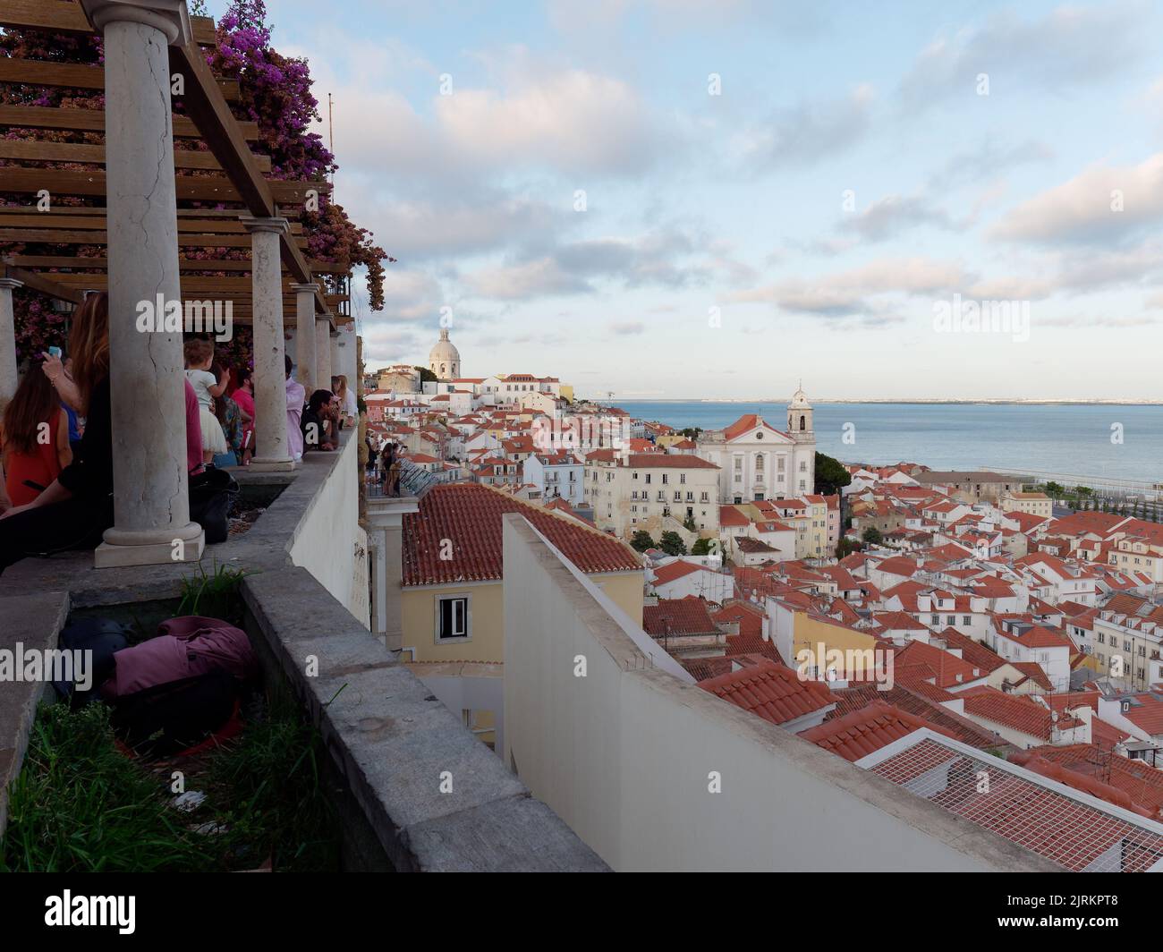 View from Viewpoint Miradouro de Santa Luzia in Lisbon Portugal on a summers evening. River Tagus right. Stock Photo