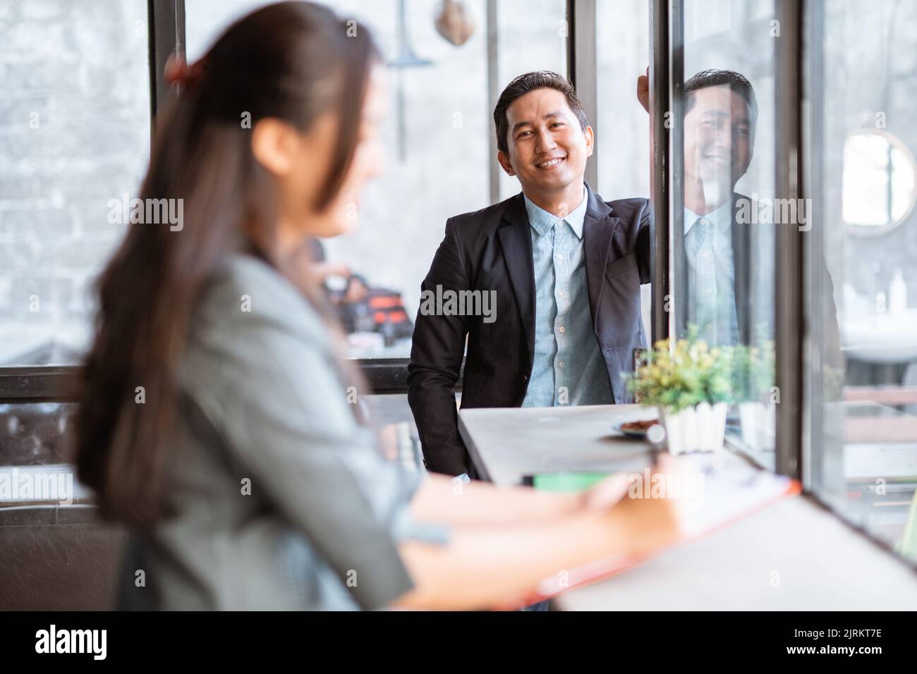 happy businessman smiling while looking at camera Stock Photo