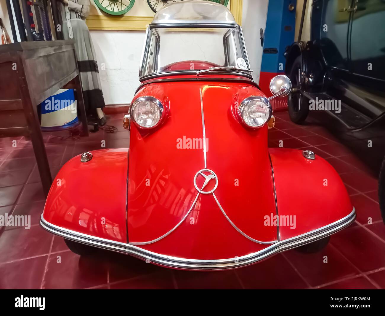 Old classic red economy Messerschmitt KR200 Kabinenroller 1959 coupe one door three wheel German micro car. Automobile Museum.  Front view. Stock Photo