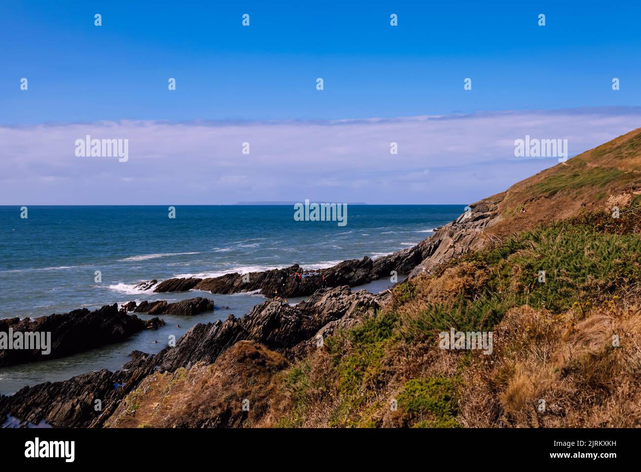 Craggy slate coastline, Croyde, Braunton, Devon, England, UK, August 2022 Stock Photo